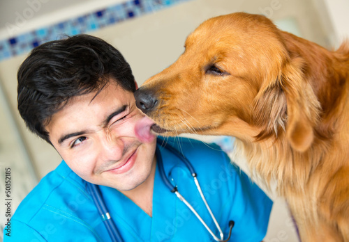 Photo: Dog kissing the vet Dog kissing the vet