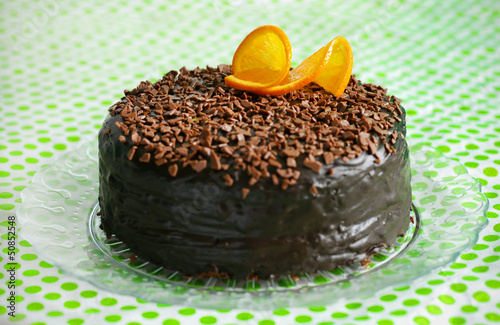 Photo: Chocolate cake covered with ganache and orange peel Chocolate cake covered with ganache and orange peel