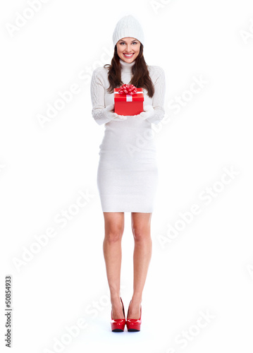 Photo: Beautiful young Christmas girl with a present. Beautiful young Christmas girl with a present.