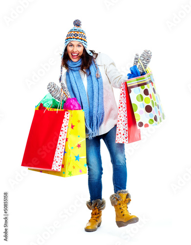 Photo: Beautiful shopping Christmas woman with bags. Beautiful shopping Christmas woman with bags.