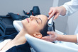 attractive woman washing her hair