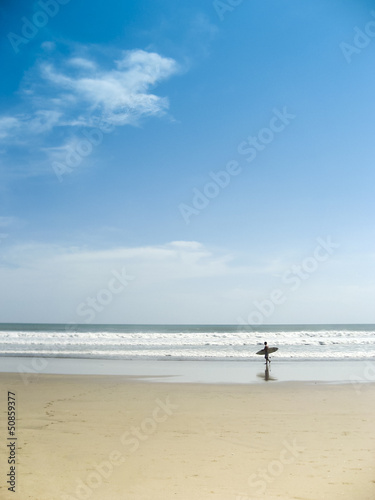 Photo: surfer on kuta beach bali indonesia surfer on kuta beach bali indonesia