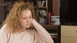 Depressed girl alone in home - tracking shot