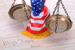 Scales of justice , American flag and US Constitution