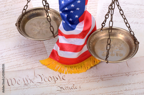 Photo: Scales of justice , American flag and US Constitution Scales of justice , American flag and US Constitution