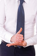 Businessman gesturing with both hands.