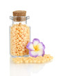 Little bottle full with colorful beads isolated on white