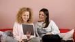 Two friends having video conversation by tablet - tracking shot