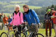 Cheerful cyclist couple with mountain bikes