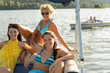 Young women sunbathing on boat