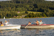 Young friends having fun in motorboats