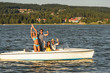 Young friends enjoying summer on speed boat