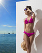 pretty brunette with bikini turned at right