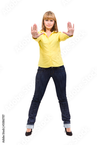 Photo: Serious woman making stop hand sign palm gesture Serious woman making stop hand sign palm gesture