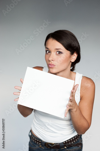 Photo: cheerful girl holding sign cheerful girl holding sign