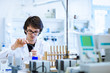 Young male researcher carrying out scientific research in a lab