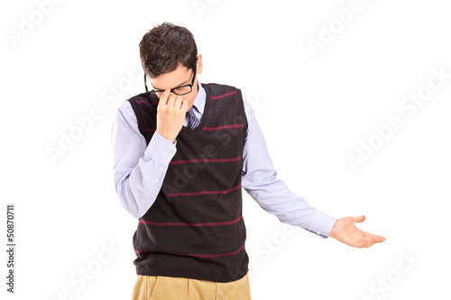 Photo: Upset young man holding his head Upset young man holding his head