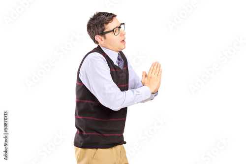 Photo: Young casual man begging Young casual man begging
