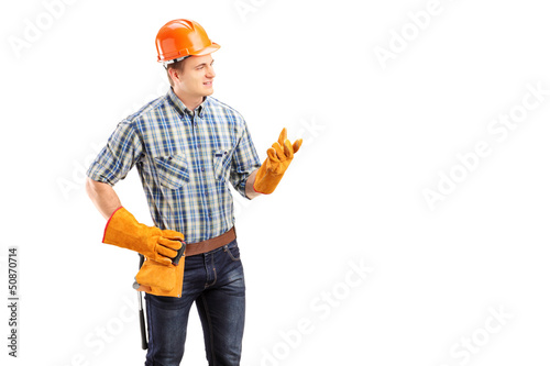 Photo: Young male contractor with construction helmet Young male contractor with construction helmet