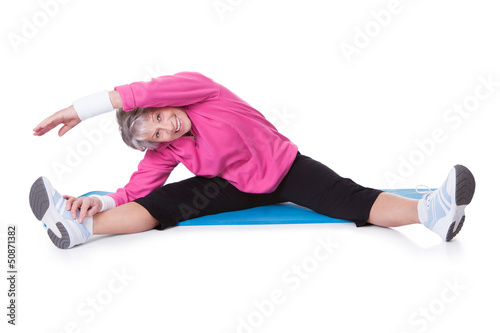 Photo: Portrait Of Senior Woman Exercising Portrait Of Senior Woman Exercising
