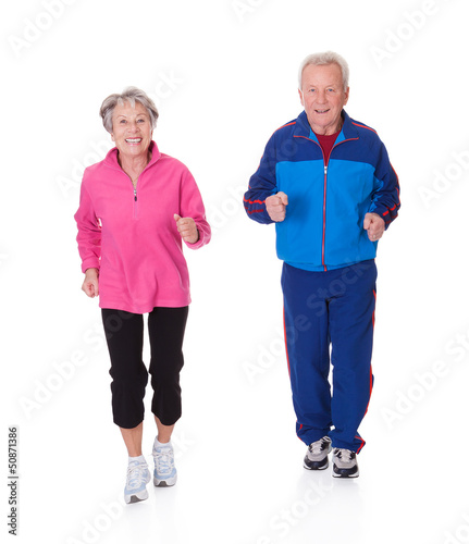 Photo: Portrait Of Senior Couple Jogging Portrait Of Senior Couple Jogging