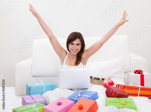 Photo: Young Woman Shopping Online Young Woman Shopping Online