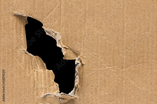 Photo: black hole in a cardboard background black hole in a cardboard background