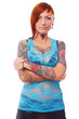 Photo: Red head woman with stylish haircut is standing with a crossed h Red head woman with stylish haircut is standing with a crossed h