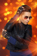 Photo: Hit rock diva in orange spotlights Hit rock diva in orange spotlights