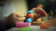 Girl moulding from clay. 1080p.