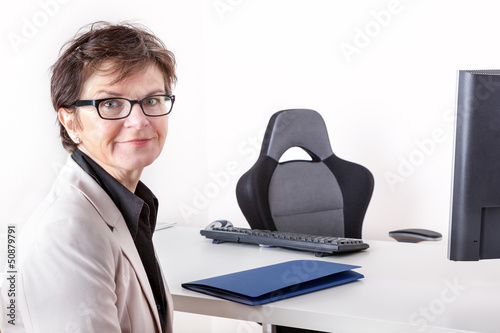 Photo: Woman waiting at the office of the Chief Woman waiting at the office of the Chief