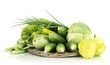 fresh green vegetables on wicker mat isolated on white
