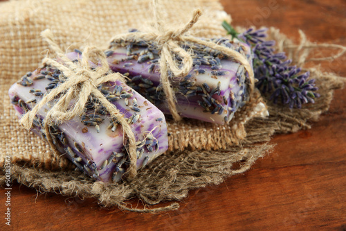 Photo: Natural handmade soap, on wooden background Natural handmade soap, on wooden background