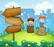 Two boys playing sack race near the arrow boards