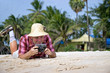 traveler photographing at the beach