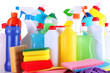 Different kinds of house cleaners and colorful sponges, gloves