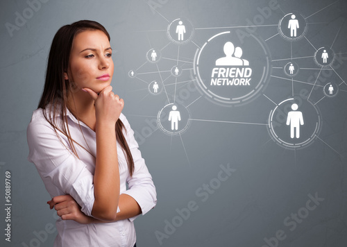 Photo: Attractive girl looking at modern social network Attractive girl looking at modern social network