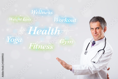 Photo: Clinical doctor pointing to health and fitness collection of wor Clinical doctor pointing to health and fitness collection of wor