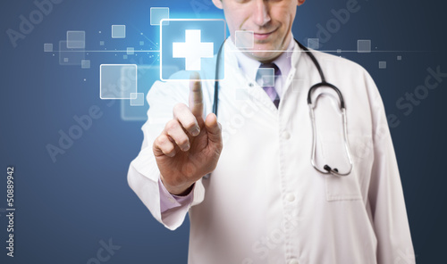 Photo: Doctor pressing modern medical type of button Doctor pressing modern medical type of button