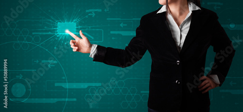 Photo: Woman pressing high tech type of modern buttons Woman pressing high tech type of modern buttons