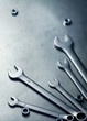 Foto: Wrenches, nuts and on a metal plate Wrenches, nuts and on a metal plate