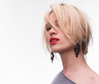 Portrait of young beautiful blond girl with red lipstick