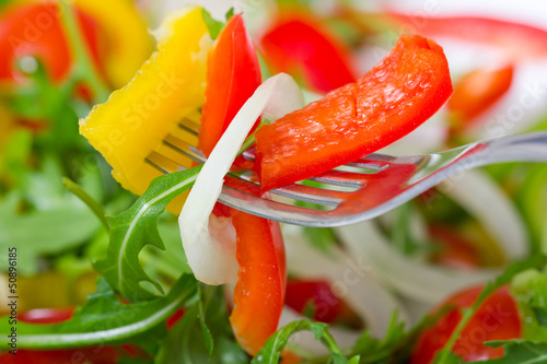 Photo: Fresh salad in the plate closeup Fresh salad in the plate closeup