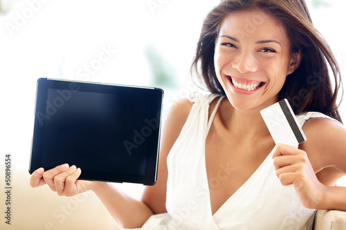 Photo: Internet shopping woman online with tablet pc Internet shopping woman online with tablet pc