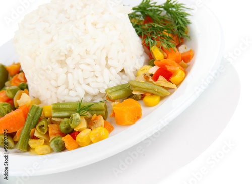 Photo: Delicious risotto with vegetables isolated on white Delicious risotto with vegetables isolated on white