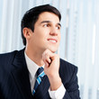 Portrait of thinkihg businessman at office