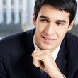 Portrait of thinkihg businessman at office