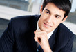 Portrait of thinkihg businessman at office