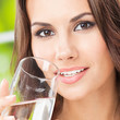 Young woman drinking water, outdoor