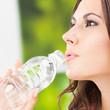 Young woman with water, outdoors
